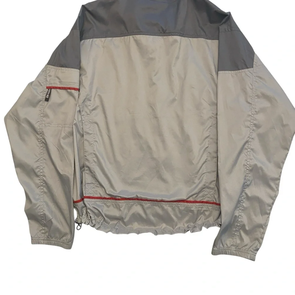 The North Face Men's Gray Windbreaker with Red Accents Size M.